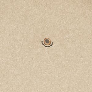 A notepad featuring a seed design on a beige cover, with a logo in the centre.