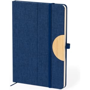 A navy notepad with a textured cover and a wooden accent, featuring a strap closure and an elastic band.