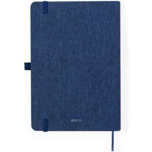 A navy blue notepad with an elastic band closure and ribbon bookmark, featuring a logo on the front cover.