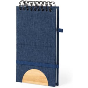 A navy blue spiral-bound notebook with a wooden accent and an elastic band closure.