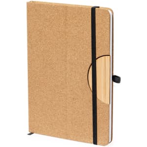 A cork-covered notepad with a bamboo accent and black elastic band, featuring a logo.