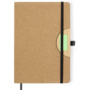 A cork-covered notepad with a black elastic band, featuring a wooden accent and a green insert.