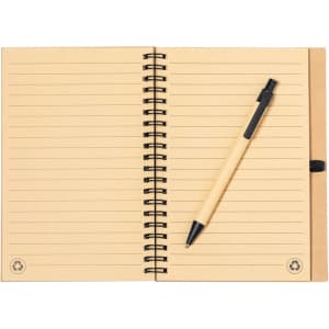 A beige spiral-bound notebook with lined pages and a black pen resting on top. The notebook features a logo.