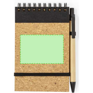 A cork notebook with a black top, spiral binding, and a pen attached, featuring a blank green area.