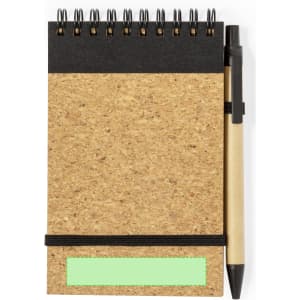 A cork-textured notebook with a black top, spiral binding, and a ballpoint pen attached. Features a logo.