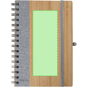 A notebook with a bamboo cover, grey fabric side, spiral binding, and a green empty space for branding.