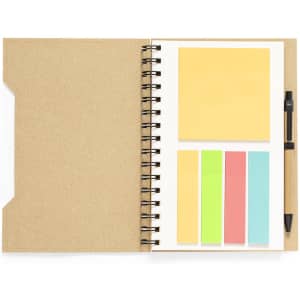 A notebook with a brown cover, white pages, sticky notes in yellow, green, and pink, and a black pen.