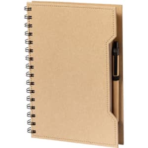 A tan spiral-bound notebook with a pen nestled in the side pocket and a simple design. It features a logo on the front.