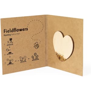 A brown cardboard packet containing heart-shaped seed paper with instructions for planting fieldflowers.