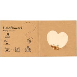 A brown cardboard packet containing heart-shaped seeds with planting instructions and illustrations.