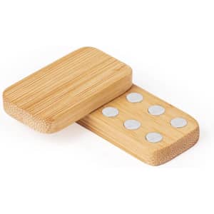 A bamboo stress relief toy shaped like a domino, featuring circular metal discs on one side.