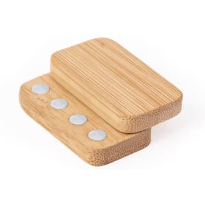 Two bamboo stress shapes stacked on top of each other, featuring smooth round metal discs on one side.