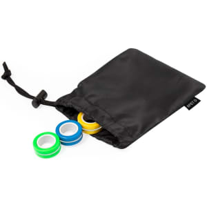 A black drawstring pouch containing three coloured rings in green, blue, and yellow.