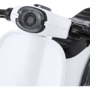 A close-up of a white and black novelty item, featuring a handle and control details at the front.