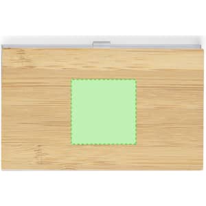 A bamboo business card holder with a clear lid and a square green patch. It features a logo.