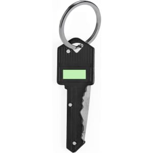A black pocket knife shaped like a key, attached to a silver keyring, featuring a textured surface and a green label.