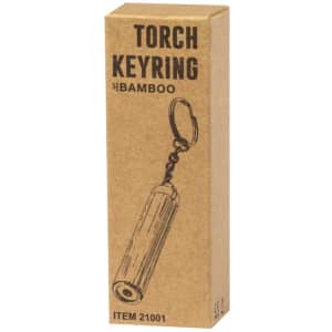 A bamboo torch keyring in a cardboard box, featuring a metal keyring attachment. The packaging has a simple illustration.