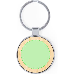 A circular keyring with a silver metal frame and a wooden texture background in green and natural tones.