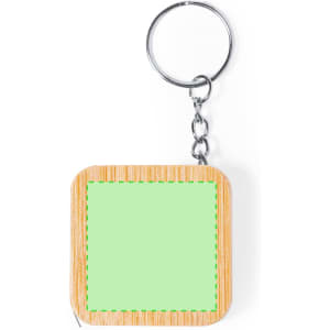 A square tape measure in a wooden-like casing with a green tape, attached to a metal keyring.