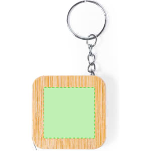 A square tape measure in bamboo and light green, attached to a silver keyring.