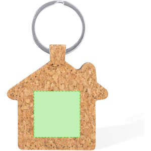 A cork keyring shaped like a house with a circular metal ring and a blank green square area.