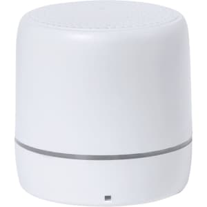 A compact white speaker featuring a smooth surface and a circular design, with a subtle branding logo.