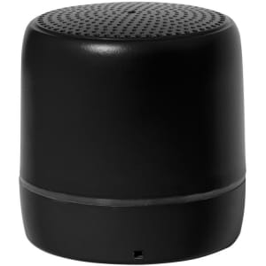 A black portable speaker with a rounded design and perforated top, featuring a logo on its surface.