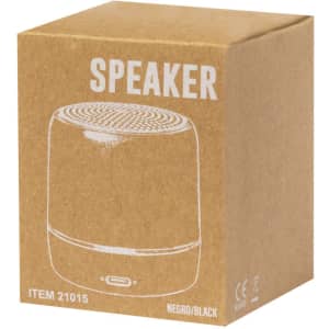 A black speaker in a brown cardboard box, featuring a logo on the packaging.