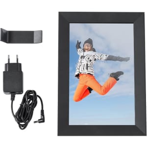 A black digital photo frame with an image of a person jumping, accompanied by a power adapter and a stand.