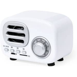 A compact white speaker with a retro design, featuring control knobs and ports, including a USB and SD slot.