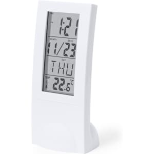 A white digital weather station display featuring time, date, day, and temperature readings.