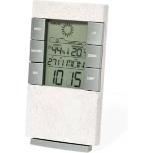 A weather station in a light grey design with a digital display and control buttons for settings and mode adjustments.