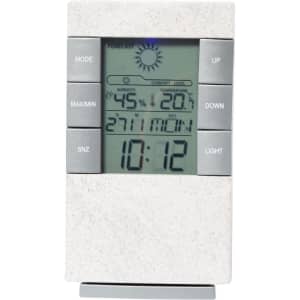 A white and silver weather station displaying temperature, humidity, and time with a digital screen and buttons.