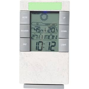 A weather station with a white body displaying temperature, humidity, and time, featuring various control buttons.