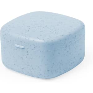A blue, speckled square case designed for storing earphones, featuring a hinged lid and a smooth finish.
