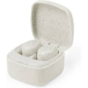 A pair of grey earbuds in a white speckled charging case, showcasing a simple and eco-friendly design.