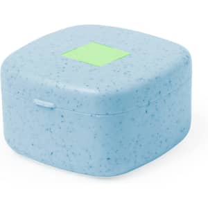 A square, speckled blue case with a smooth surface and a green label on top. Ideal for storage or accessories.