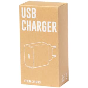 A USB charger in a brown box, featuring a minimalist design and a visible plug. The box has a logo.