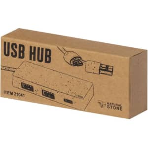A cardboard box containing a USB hub, featuring multiple ports and a simple design. The box has a logo.