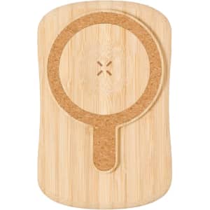 A wooden power bank with a cork surface and a circular indentation, featuring a minimalistic design.