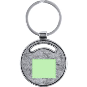 A silver keyring featuring a round design with a grey textured surface and a green area at the centre.