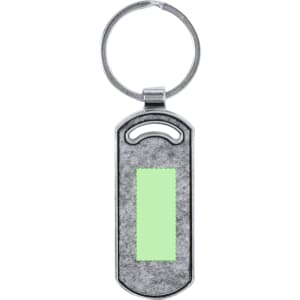 A silver keyring with a rectangular green area for customisation. It features a simple loop attachment.