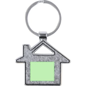 A silver house-shaped keyring featuring a green insert and a metal loop for attachment.