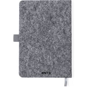 A grey notepad with a felt cover, featuring an elastic closure and a ribbon bookmark. Includes a logo.