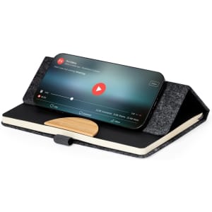 A notepad with a grey felt cover and wooden phone holder, designed to hold a smartphone for easy viewing.