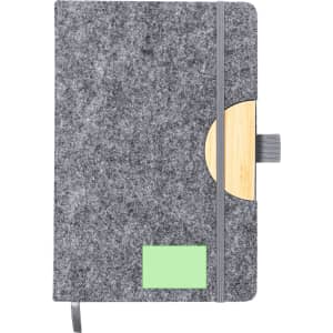A grey felt notepad with a bamboo accent and an elastic closure, featuring a green placeholder.