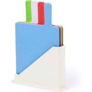 A cutting board set featuring blue, green, red, and pink boards, displayed in a white storage stand.