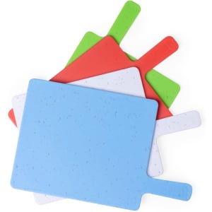 A cutting board set featuring blue, red, green, and white boards with handles. Includes a brand logo.