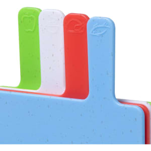 A set of multi-coloured cutting boards in green, white, red, and blue, featuring a logo on the handles.