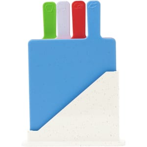 A set of four colourful cutting boards in blue, green, red, and white, arranged in a stand.